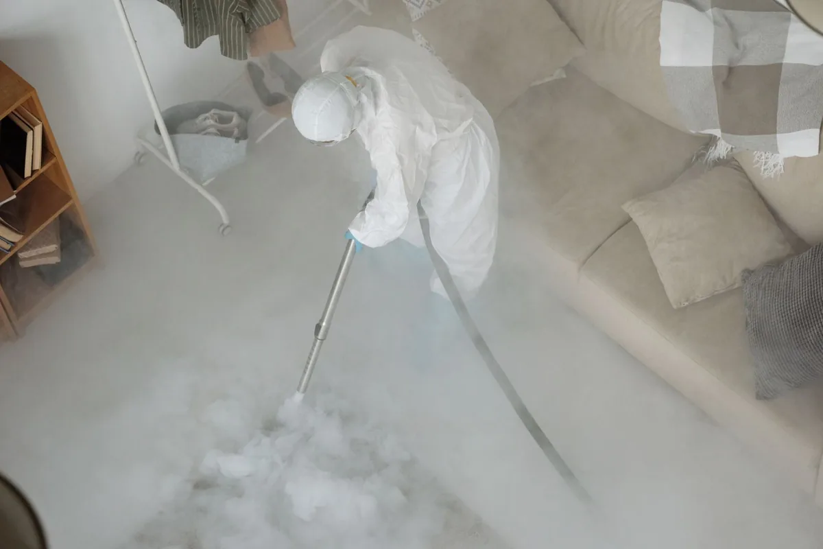 Biohazard cleanup technician in protective equipment, Bluff City, TN